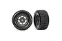 Two Traxxas 1/10 scale Hoosier dirt oval front wheels with graphite grey rims and black rubber tires against a white background.