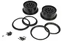 Two black RC car rims with matching beadlock rings and a set of small mounting screws on a white background.