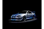 A studio shot of a silver 1999 Nissan Skyline GT-R R34 model car with blue racing stripes and decals against a black background.