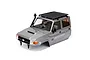 A grey RGT 1/10 scale LC79 Land Commander RC body shell with a black roof rack, snorkel, and driver figure, isolated on a white background.