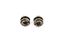 Two RGT metal transmission sliders for RC vehicles, shown from a top-down perspective against a white background.