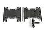 Two black plastic Axial SCX10 II skid plates on a white background, one with a small attached sprue piece.