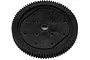 A black plastic RC spur gear with a central hole and multiple small holes around the center, isolated on a white background.