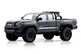 Grey FMS Toyota Tacoma 1/24 scale RC rock crawler studio product photo on a white background