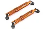 Two orange anodized aluminium RC drive shaft assemblies with black metal universal joints at each end, shown against a white background.