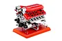 A detailed studio product shot of the Teching DM108 V12 Engine Scaled Metal Model Kit mounted on a red wooden base against a white background.