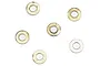 Six small circular metal washers arranged on a plain white background.