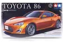 Tamiya 1/24 scale Toyota 86 plastic model kit box art showing an orange Toyota 86 sports car.