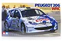 Tamiya 1/24 scale Peugeot 206 WRC plastic model kit box art showing the rally car in action.