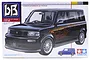 Tamiya 1/24 scale Toyota bB plastic model kit box art featuring a black car with flame decals.