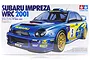 Product box for Tamiya 1/24 scale Subaru Impreza WRC 2001 model kit featuring a blue rally car with yellow decals.