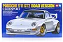 Tamiya 1/24 scale Porsche 911 GT2 Road Version Club Sport plastic model kit box art featuring a silver Porsche on a blue background.