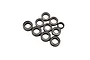 A set of various sized metal ball bearings arranged against a plain white background.