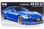 Tamiya 1/24 scale Subaru BRZ plastic model kit box art showing a blue sports car on a black background.