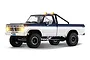 FMS FCX18 II Ford F-100 1/18 scale RC rock crawler truck in blue and white with lit headlights and roll bar.