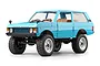 Blue MN Model Range Rover RC rock crawler featuring large off-road tires, a detailed tan interior, and a clean white background.