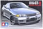 Tamiya 1/24 scale Nissan Skyline GT-R (R32) NISMO-Custom plastic model kit box art featuring a silver car.