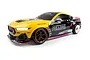 Studio product shot of the HPI Stage-D10 Ford Mustang GT Spec-5 FD RC drift car featuring yellow and black livery with Pennzoil branding.