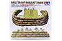 Tamiya 1/35 scale Sand Bags Set plastic model kit box, featuring illustrations of soldiers behind sandbag fortifications and an artillery piece.