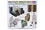 Tamiya 1/35 scale Jerry Cans Set plastic model kit box art showing various military fuel drums, jerry cans, buckets, and soldier figures.