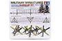 Tamiya 1/35 scale Barricade Set plastic model kit box art showing illustrations of barbed wire obstacles and anti-tank obstacles.