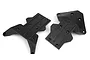 Two black molded plastic RC skid plates shown from above against a clean white background.