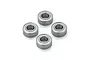 Four metal shielded ball bearings arranged in a diamond pattern against a plain white background.