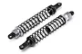 Two silver and black RC rear shock absorbers with coiled springs shown on a white background.