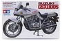 Product box art for Tamiya 1/12 Suzuki GSX1100S Katana plastic model kit featuring a detailed illustration of the silver motorcycle.