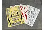 Multiple RC car decal sheets featuring TEC-ARTS branding, sponsor logos, and various decorative graphic stripes laid out on a dark surface.