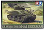 Tamiya 1/48 scale U.S. M4A1 Sherman Medium Tank plastic model kit box art showing a painted tank in a battlefield scene.