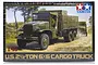 Tamiya 1/48 scale U.S. 2.5 Ton 6x6 Cargo Truck plastic model kit box art showing a military truck driving on a dirt road.