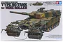 Tamiya 1/35 scale Japanese Type 90 Tank with Mine Roller plastic model kit box art showing a camouflaged tank with front-mounted mine rollers.