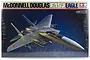 Tamiya 1/32 scale McDonnell Douglas F-15J Eagle plastic model kit box art showing a grey fighter jet in flight against a dark blue background.