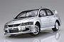 A completed and painted silver 1/24 scale model of a Mitsubishi Lancer Evolution IX GSR car on a reflective white background.
