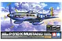 Tamiya 1/32 scale North American P-51D/K Mustang Pacific Theater plastic model kit box art showing a silver fighter plane in flight.
