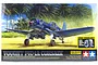 Tamiya 1/32 scale Vought F4U-1A Corsair model kit box art featuring a blue fighter plane on a tropical beach.