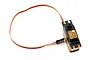 Savox SH-1357 digital mini servo featuring an orange housing and black top with connected wiring harness on a white background.