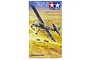Tamiya 1/48 scale Fieseler Fi156C Storch model kit box art showing the aircraft flying over a desert landscape with military vehicles below.