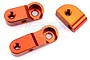 Three orange anodized aluminium chassis brace mounts for an RC car, shown from a top-down perspective on a white background.