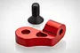 A red anodized aluminium engine mount component for an RC car, accompanied by a single black countersunk machine screw.