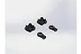 Two black plastic shock spring retainers and two black plastic shock rod ends arranged on a plain white background.