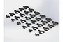 A collection of black plastic C-clip suspension spacers of varying sizes arranged on a white background.