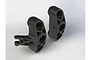 A pair of black ARRMA RC steering blocks shown from a high angle against a white background.