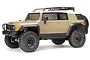 A studio shot of the HPI Venture Sandstorm Toyota FJ Cruiser RC rock crawler, featuring a tan body, black roof rack, and off-road tires.