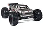 ARRMA Outcast BLX 1/8 scale RC stunt truck in metallic grey with large off-road tires and a roll cage, shown from a front three-quarter angle.