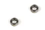Two small metal shielded ball bearings isolated on a white background.