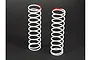Two white ARRMA RC shock springs standing upright on a dark surface, each featuring a red paint mark on the top coil for identification.