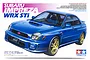 Tamiya 1/24 scale Subaru Impreza WRX STi plastic model kit box art featuring a blue sedan with gold wheels.