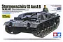 Tamiya 1/35 scale German Sturmgeschütz III Ausf.B model kit box art showing a painted tank model with a commander figure.